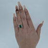 Emerald Ring with Emerald Cut Diamond Side Stones Set in 18ct White Gold